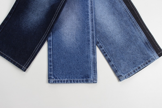 Fabricación al por mayor de tejidos de denim rígidos de algodón 100% azul oscuro para jeans