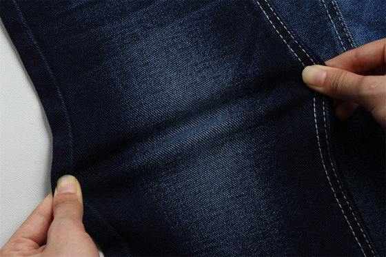 12 oz precio fuerte tejido de denim de bajo estiramiento para el trabajo del hombre usar jeans negro trasero precio competitivo de Weilong Textile