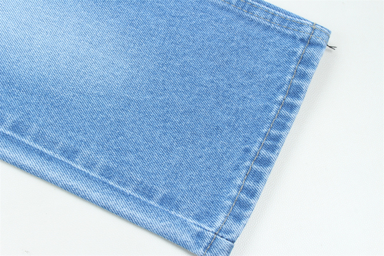 11.5 oz de tejido de denim rígido 100% C para el estilo de la marca Jeans estilo amigo del chico suave palpación Super color azul oscuro