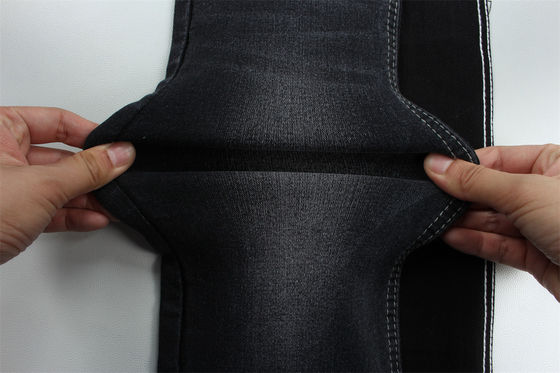 Tejido vaquero elástico negro negro de alta elasticidad con tejido satinado de licra