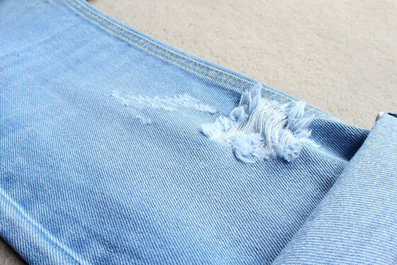 Tejido de denim rígido de algodón 100% azul oscuro para jeans