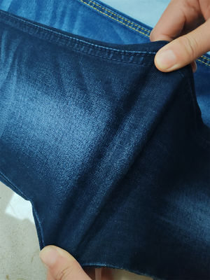 Buen precio 9 OZ tela de jeans de alta estiradura tela de jeans para mujeres delgada delgada ajuste de dama hecha en China ciudad de Guangdong Foshan en línea