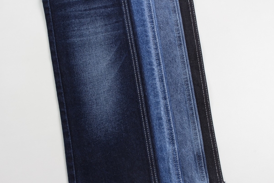Fabricación al por mayor de tejidos de denim rígidos de algodón 100% azul oscuro para jeans