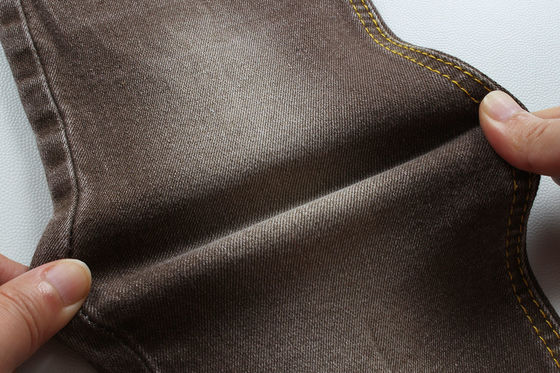 Buen precio Tejido de denim de estiramiento de color marrón para mujeres hombre jeans de estiramiento bajo Precio competitivo de China Ciudad de Foshan en línea