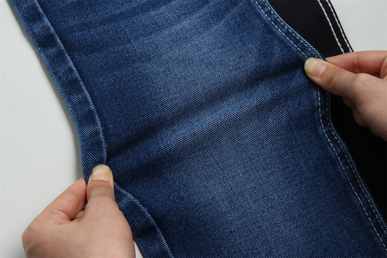 12 oz precio fuerte tejido de denim de bajo estiramiento para el trabajo del hombre usar jeans negro trasero precio competitivo de Weilong Textile