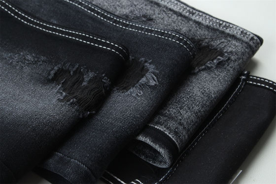Buen precio 11.5oz Tejido de denim rígido 56%C 44%P Negro y Negro Reverso Para el estilo de la marca Jeans Estilo Amigo del chico suave palpación en línea
