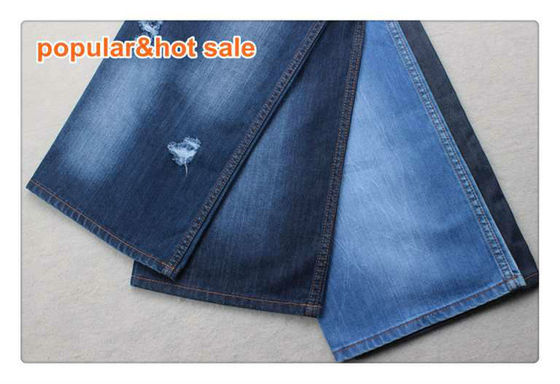 Buen precio Tela tiesa Jean Material del tejano de algodón de la mano 100 de los azules añiles de los vaqueros de la ropa 12 onzas en línea